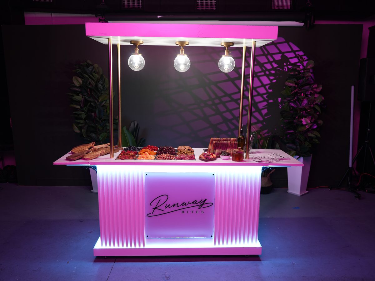 The illuminated Runway Bites grazing bar set for an event